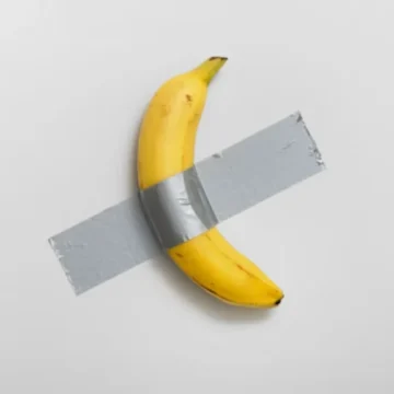 Maurizio Cattelan’s $6.2 million duct-taped banana divides the art world over meaning and madness.